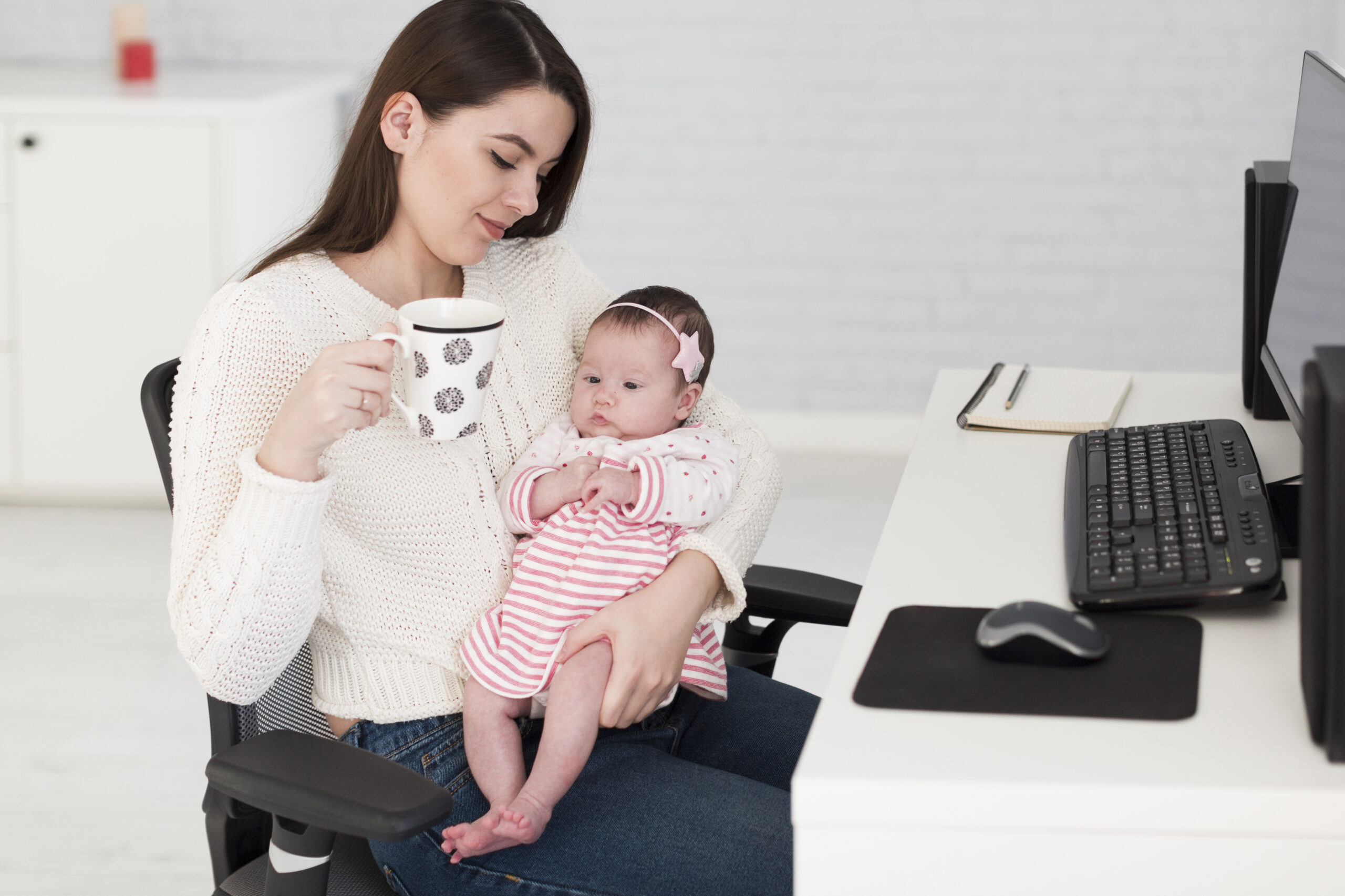 woman with cup daughter office scaled.jpg